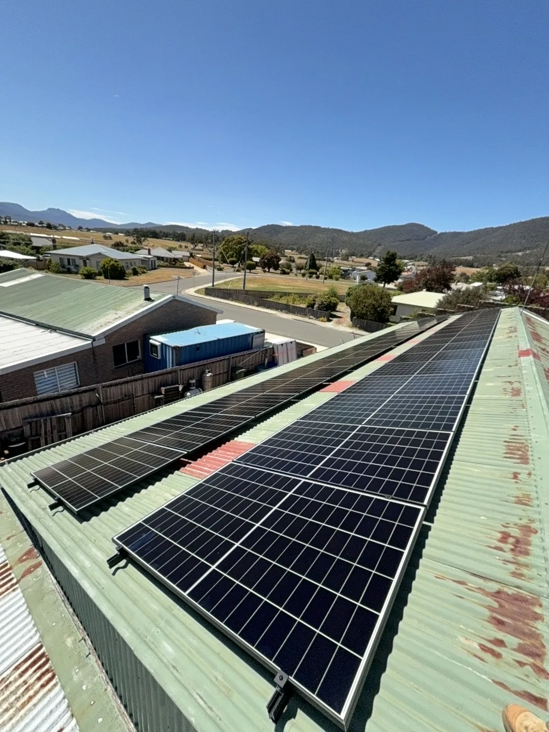 The array across the roof with the valley and mountains behind