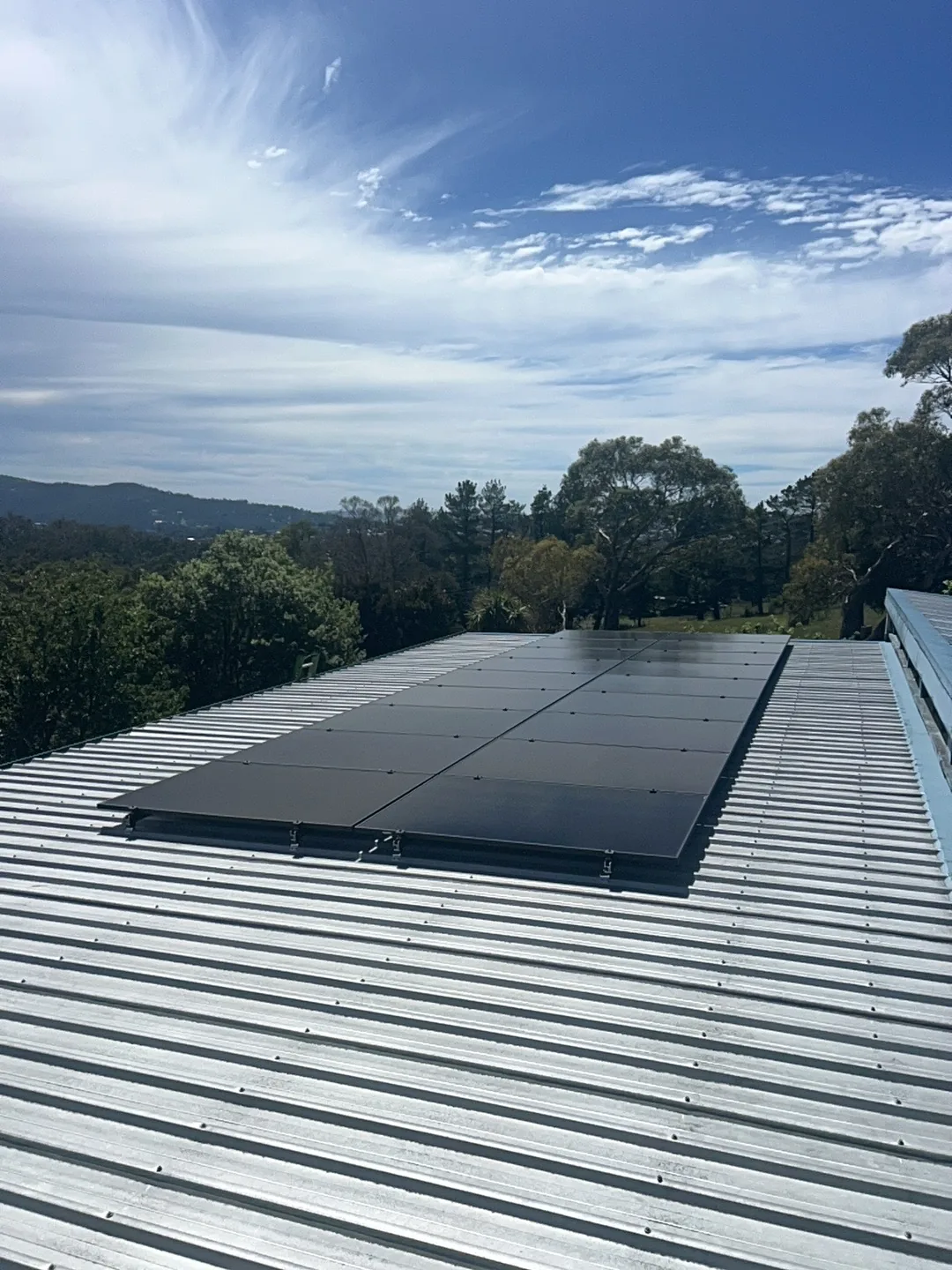The 18-panel array running along the roof sheeting