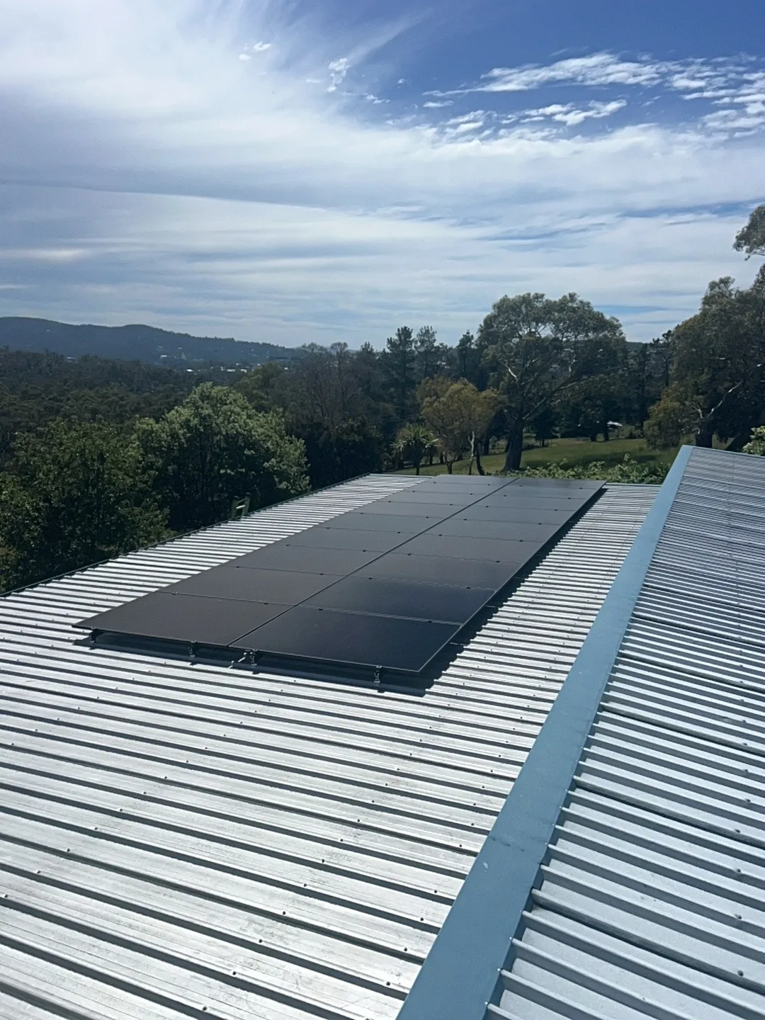Solar array on a Kingston roof looking out over the valley
