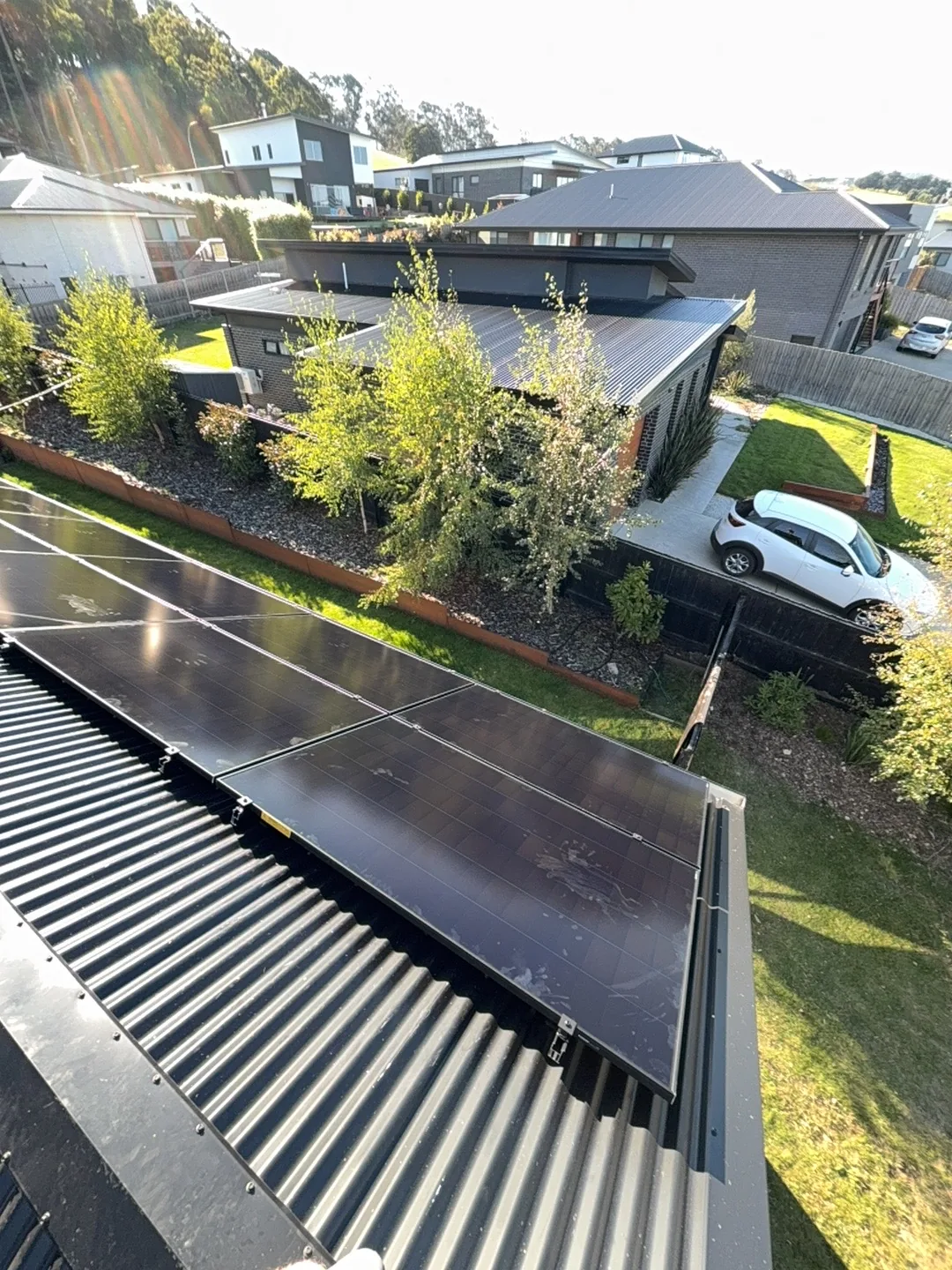 Panels angled across the roof sheeting above the driveway
