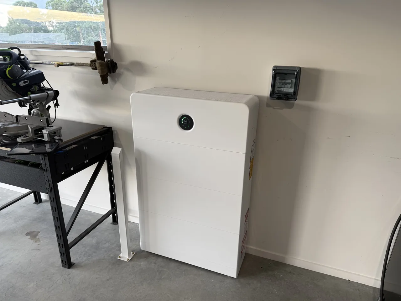 GoodWe battery cabinet installed against the wall of the garage