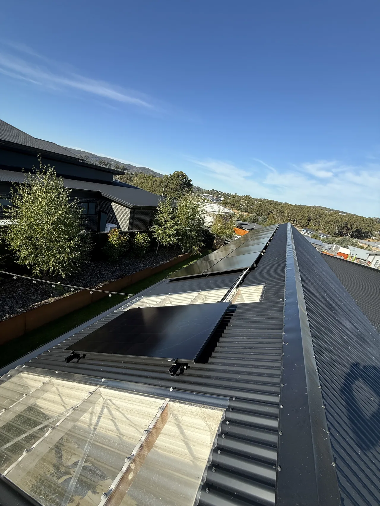 Solar array running the length of a Kingston roof above the garden
