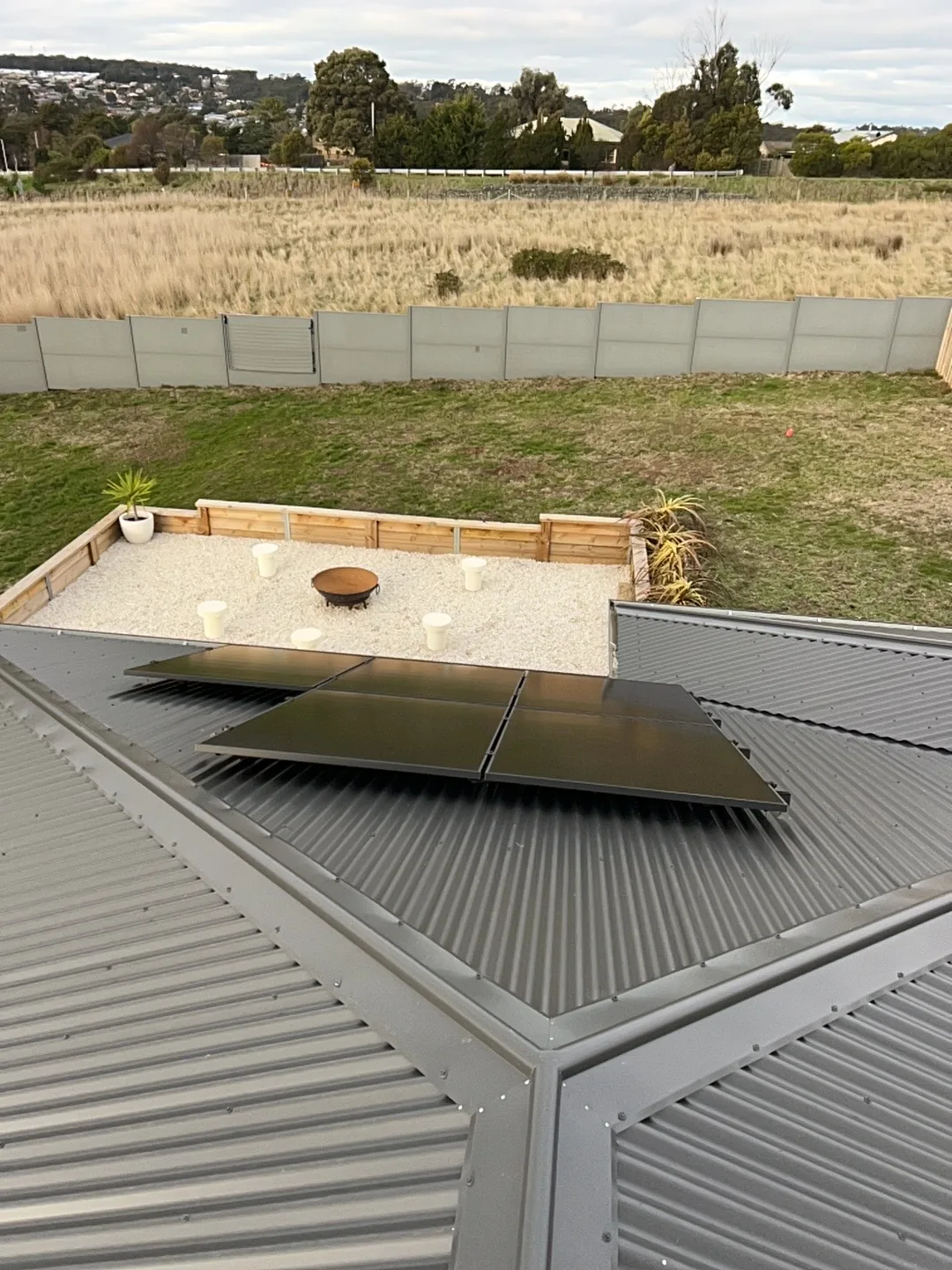 Solar array laid along the garage roof above the back garden