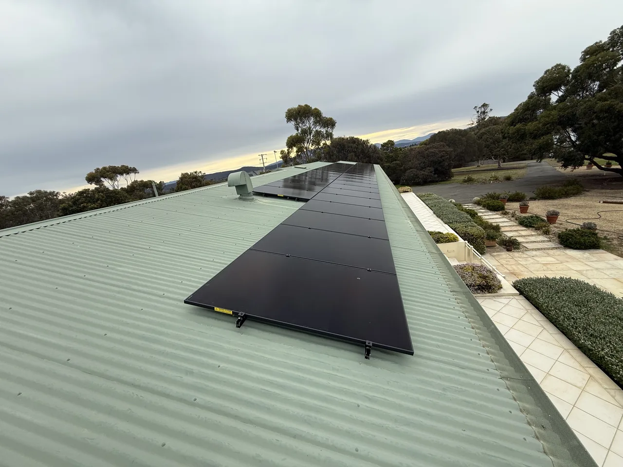 A second run of AIKO panels on another roof plane at the Sandford property, photographed late in the day