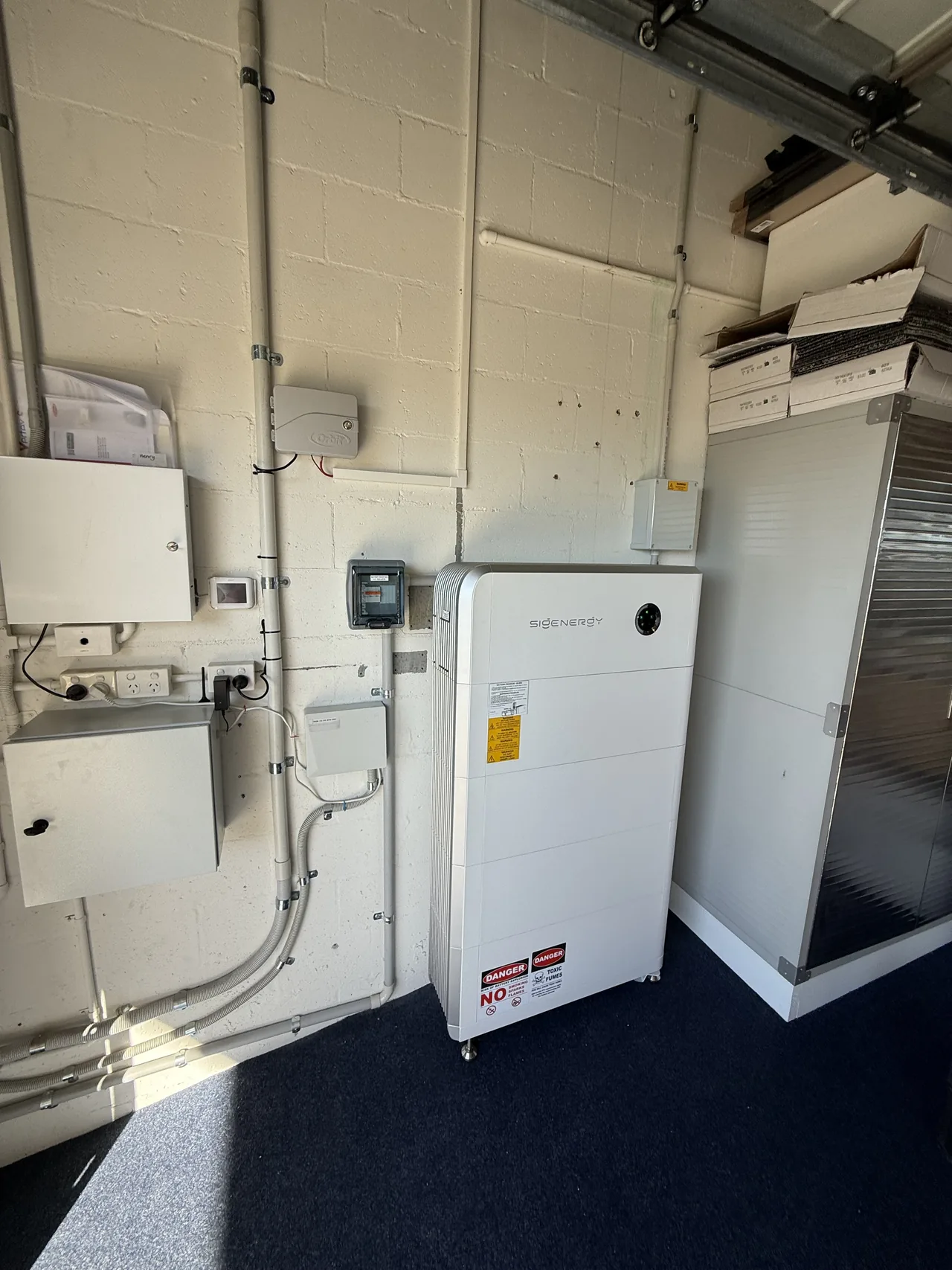Battery and associated switchgear installed in the garage